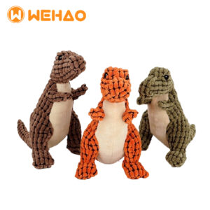 Three textured corn kernel fabric dinosaur dog squeaky chew toys in brown, orange, and green with Wehao logo, durable OEM/ODM pet toys for wholesale.