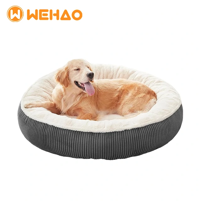 Premium round donut calming dog bed featuring dark grey ribbed corduroy exterior and off-white plush faux fur interior, designed for anxiety relief and orthopedic support, branded for Wehao Pets B2B supply.