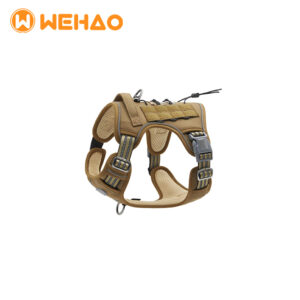 Coyote tan tactical dog harness featuring a heavy-duty control handle, Molle system for ID patches, and dual D-ring attachment points, branded for Wehao Pets B2B wholesale.