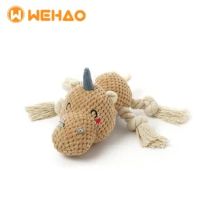tan corduroy plush unicorn dog toy featuring a blue horn, embroidered sleeping eyes, and four knotted cotton rope legs for chewing.