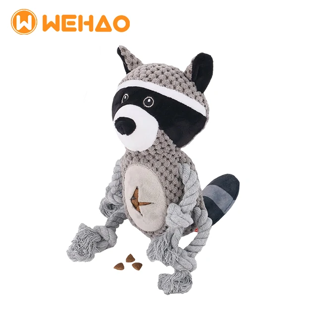 Grey plush raccoon dog toy by WEHAO with cotton rope limbs and a treat-dispensing belly for interactive puzzle play