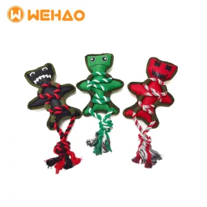 Three tough, voodoo doll-style dog rope chew toys in black, green, and red, for teething and playtime.