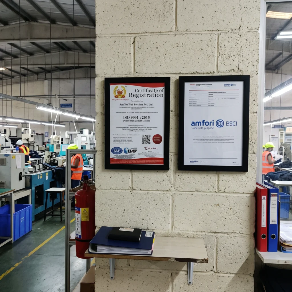 A display of framed ISO 9001 and BSCI compliance certifications on a pet toy factory wall.
